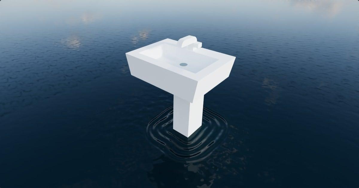 A white pedestal sink standing in dark water