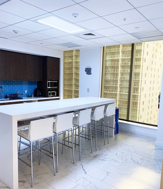 The artificial skylight from Innerscene is placed over a shared lunch area at an office.