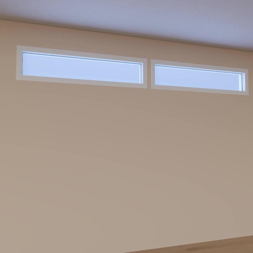 Two Circadian Sky panels mounted as clerestory windows high on a wall, glowing with daylight.