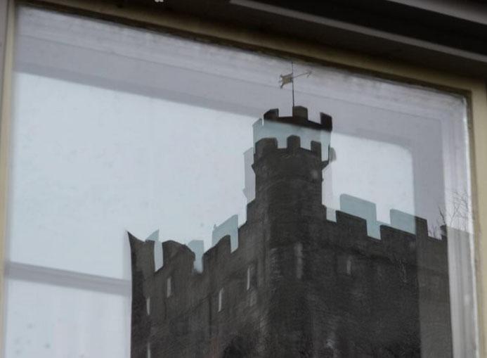 Real window showing characteristic double reflections from dual glass panes